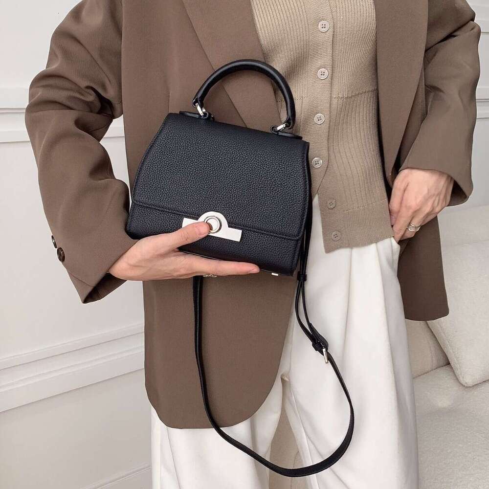 Celebrity style handbag with top layer cowhide round buckle flip cover commuter mailman bag, letter package, small square bag