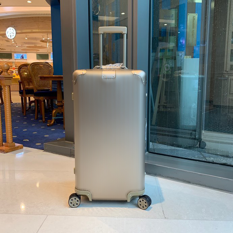 Designer Rim0 Metal combination lock suitcase Stylish luxury boarding case Designer metal combination case Spacious wheeled luggage.