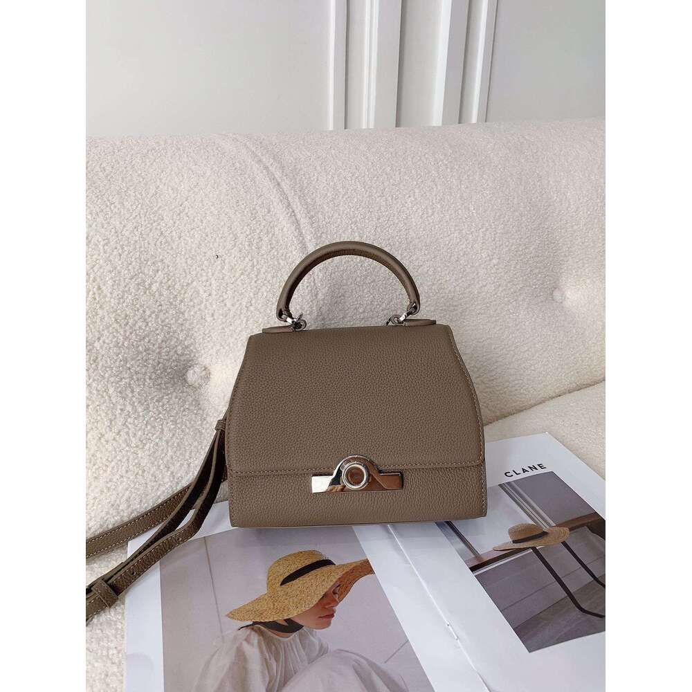 Celebrity style handbag with top layer cowhide round buckle flip cover commuter mailman bag, letter package, small square bag