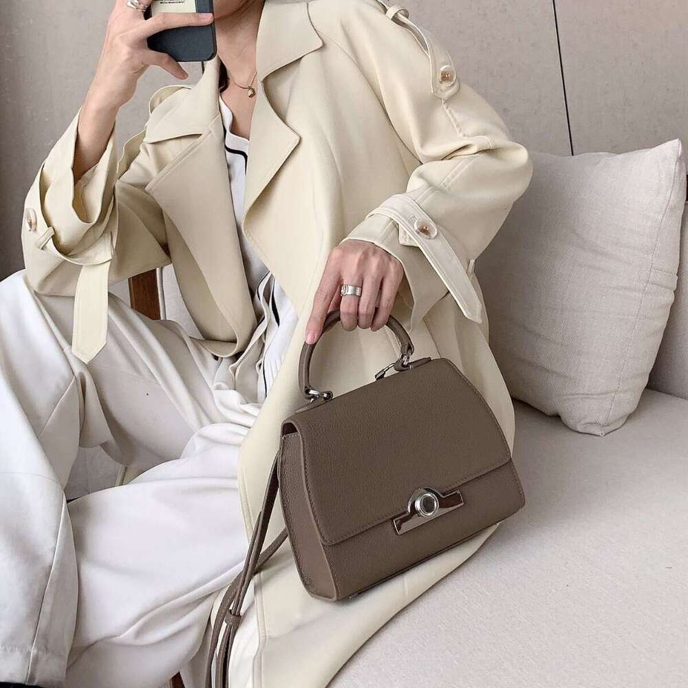Celebrity style handbag with top layer cowhide round buckle flip cover commuter mailman bag, letter package, small square bag