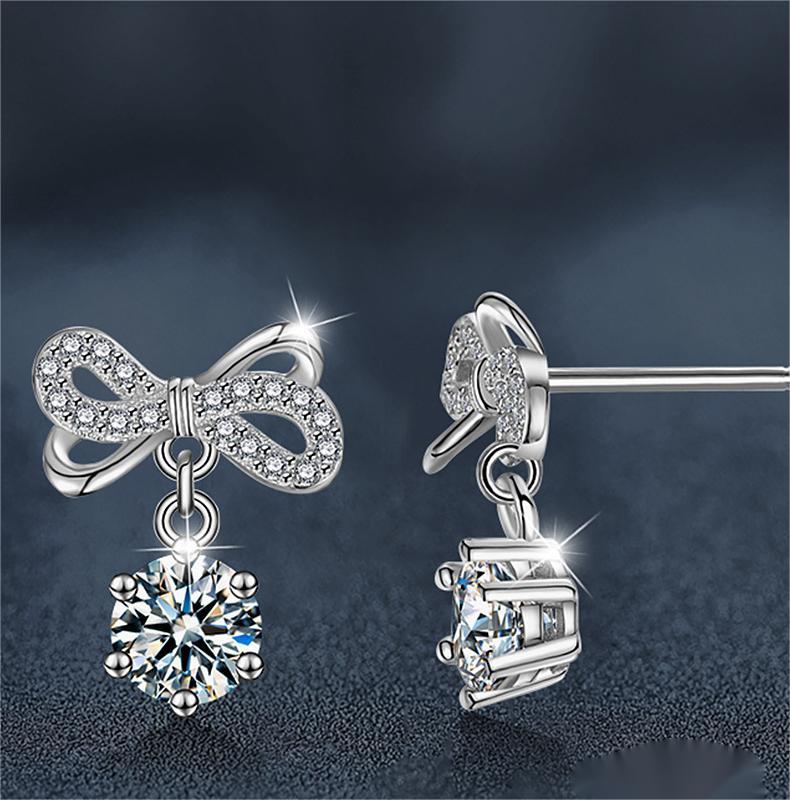 Sterling Silver Butterfly-Knot Moissanite Dangle Earrings.