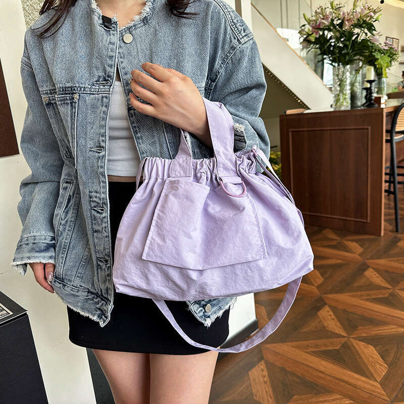 Singapore's new dumpling foldable portable soft nylon handbag for men and women, large capacity crossbody bag