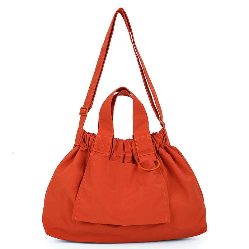 Singapore's new dumpling foldable portable soft nylon handbag for men and women, large capacity crossbody bag