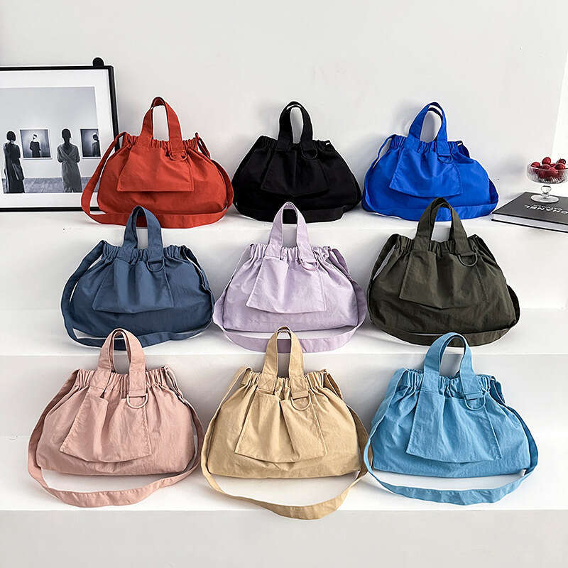 Singapore's new dumpling foldable portable soft nylon handbag for men and women, large capacity crossbody bag