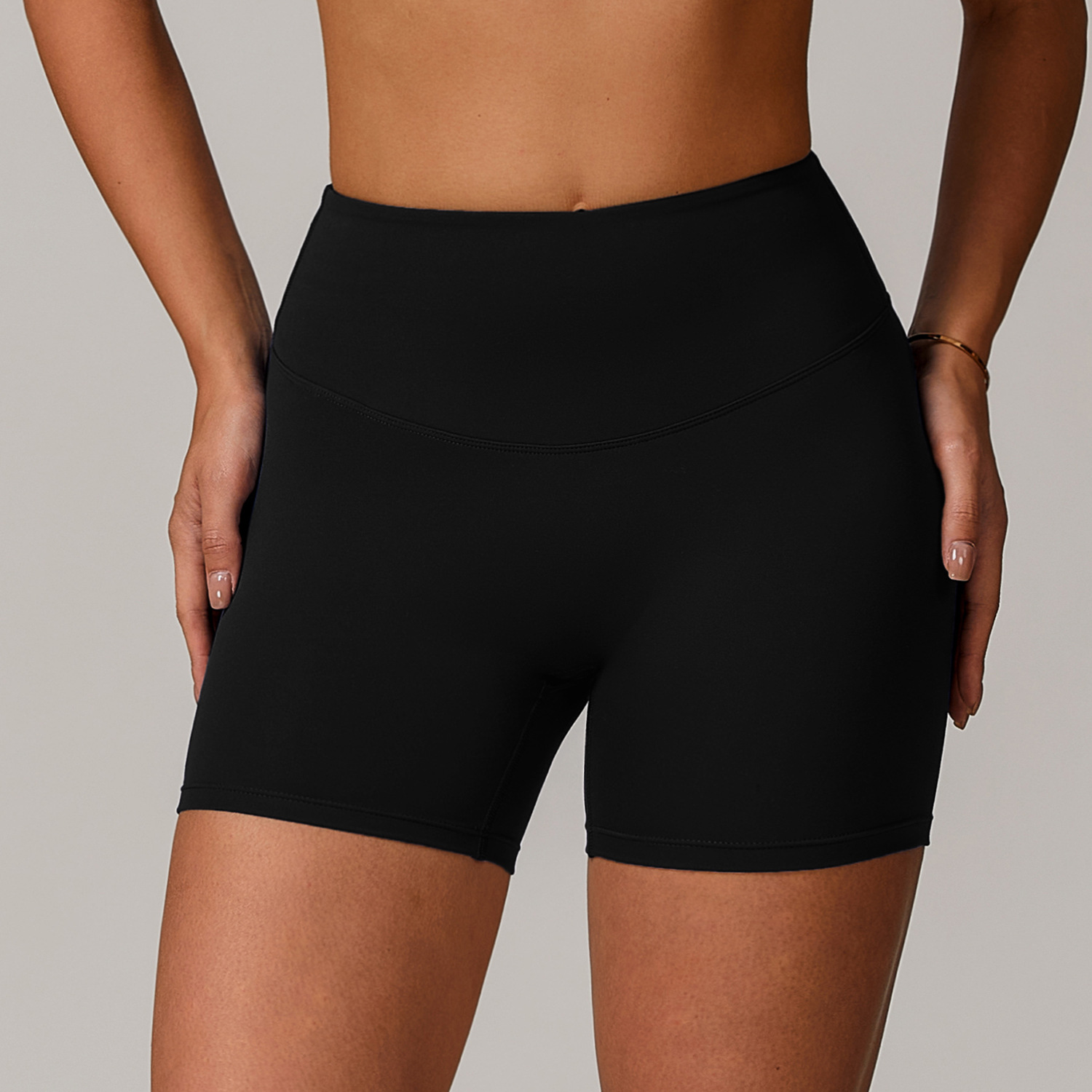 High waisted and hip lifting yoga shorts for women wearing tight fitting and slimming running sports shorts