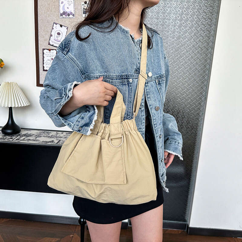 Singapore's new dumpling foldable portable soft nylon handbag for men and women, large capacity crossbody bag