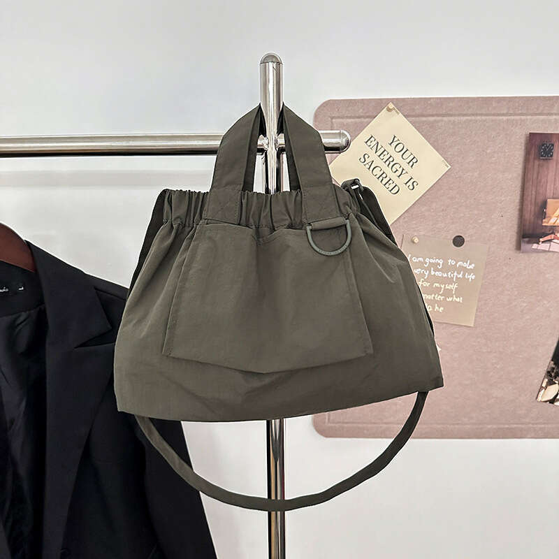 Singapore's new dumpling foldable portable soft nylon handbag for men and women, large capacity crossbody bag