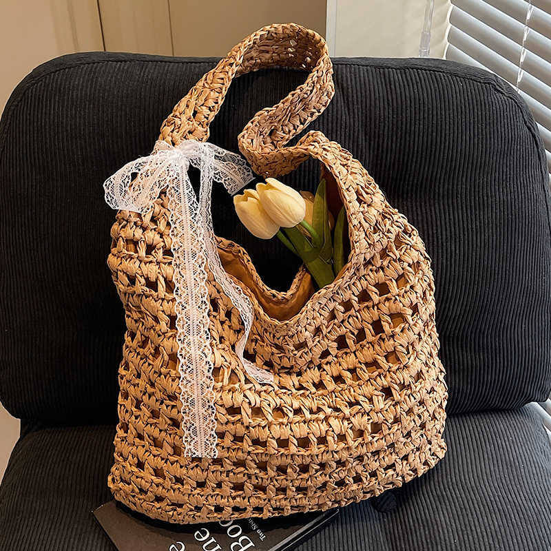 Spring and summer new lazy style artistic hollow woven tote bag casual versatile large capacity vacation style shoulder bag