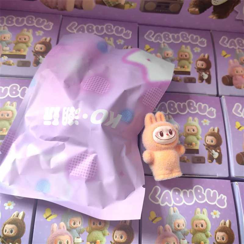 New Hot 12pcs/Set Mini Flocking Standing Labubu Blind Box Have A Seat Labubu Doll Action Figure Pendant Accessories Decoration W250508