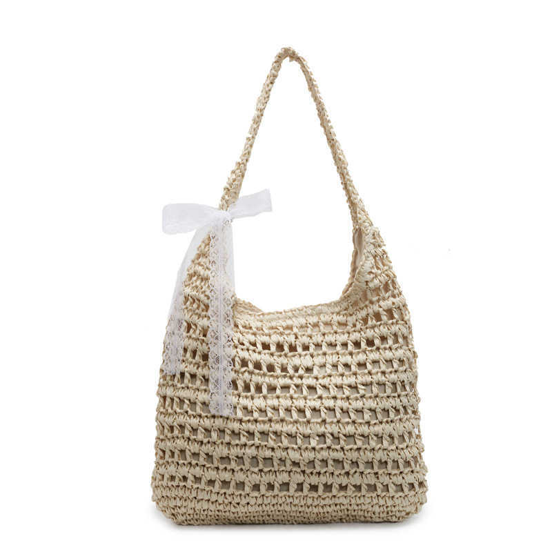 Spring and summer new lazy style artistic hollow woven tote bag casual versatile large capacity vacation style shoulder bag