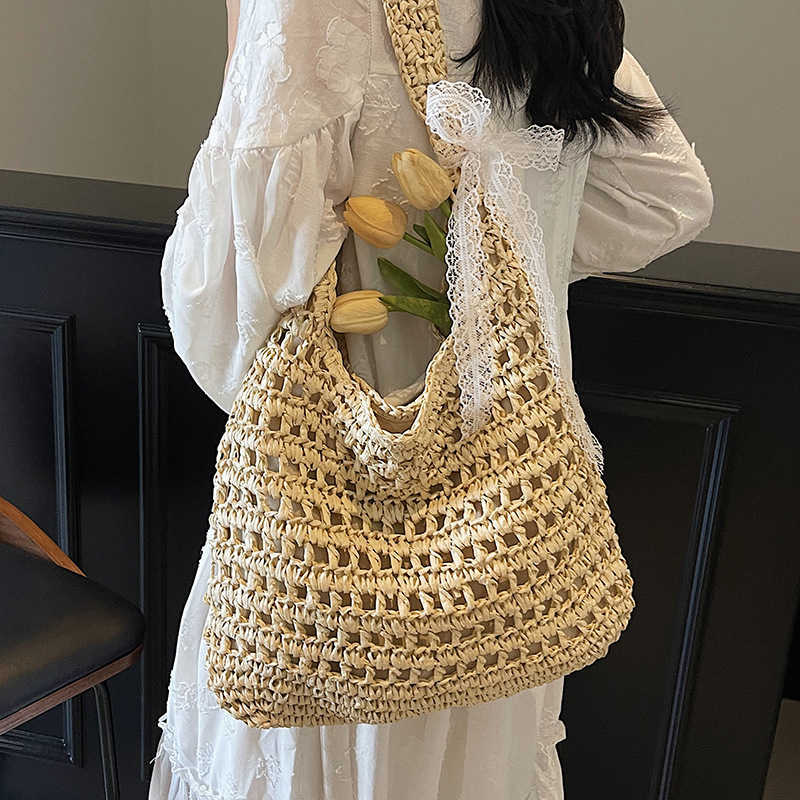 Spring and summer new lazy style artistic hollow woven tote bag casual versatile large capacity vacation style shoulder bag