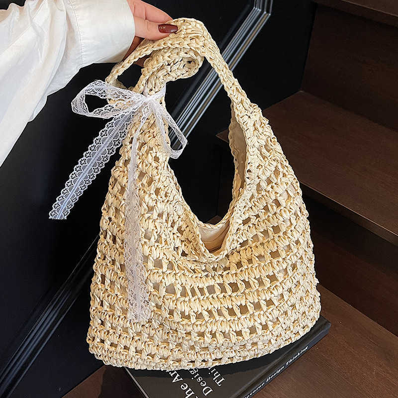 Spring and summer new lazy style artistic hollow woven tote bag casual versatile large capacity vacation style shoulder bag