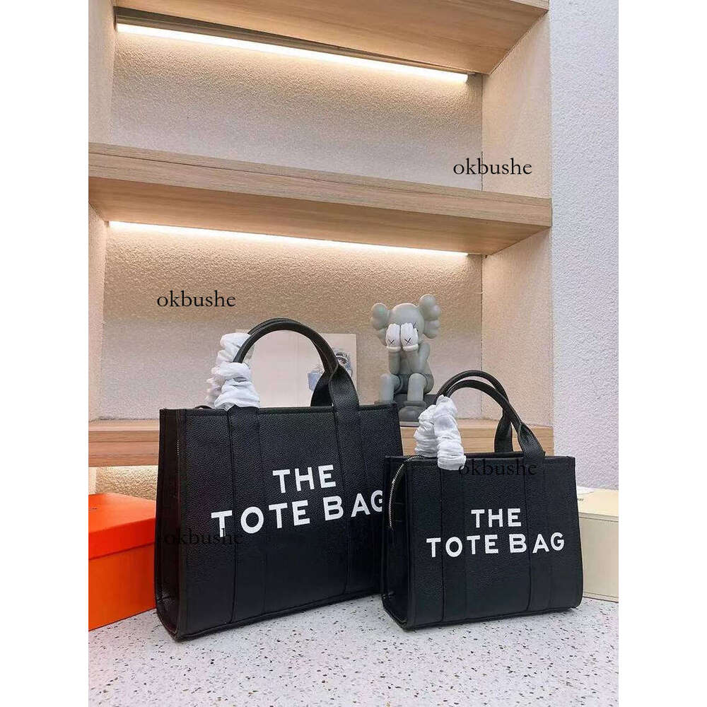 The tote bag Designer bags Women men High quality leather Fashion high-capacity Shoulder Letter printing Shopping Handbag 2 sizes multiple colors g21