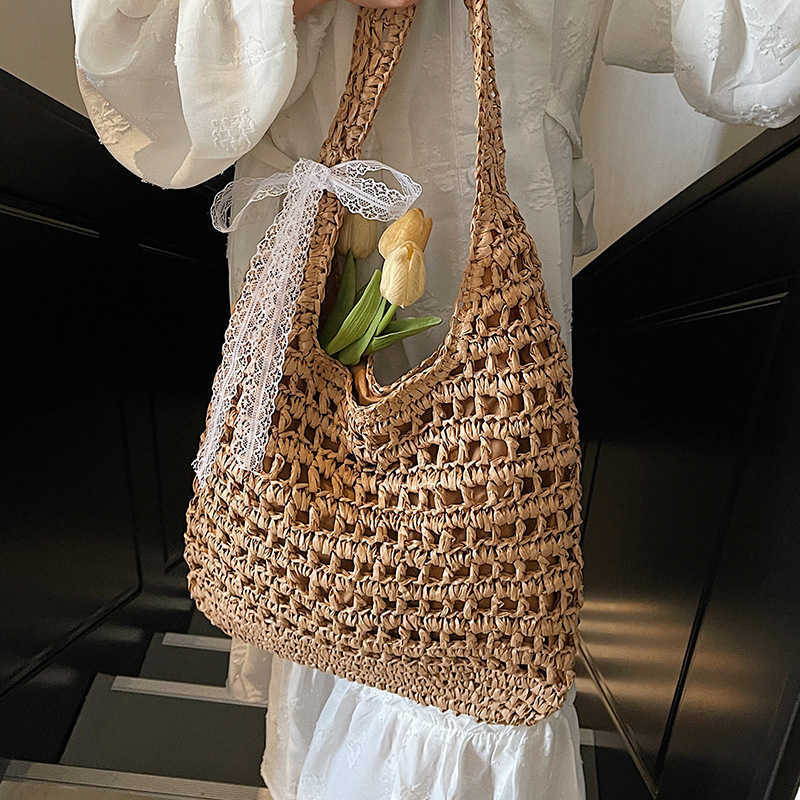 Spring and summer new lazy style artistic hollow woven tote bag casual versatile large capacity vacation style shoulder bag