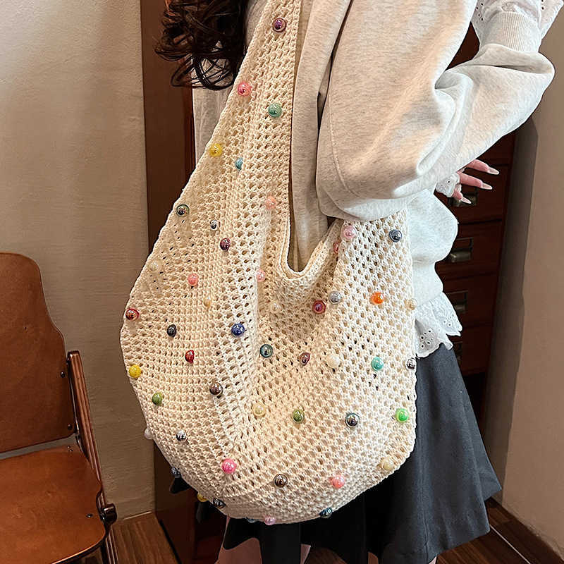 New Relaxation Large Capacity Colored Pearl Knitted Bag with Small Resort Style Hollow Beach Single Shoulder Women's Bag