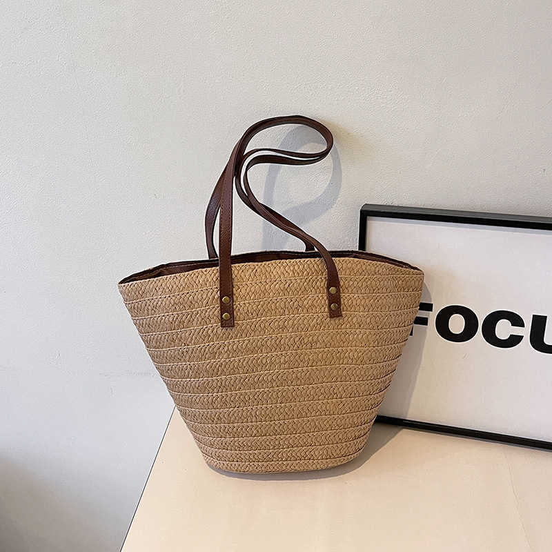 Grass woven large capacity trendy bag 2025 new tote commuting seaside vacation beach bag artistic vegetable basket bag