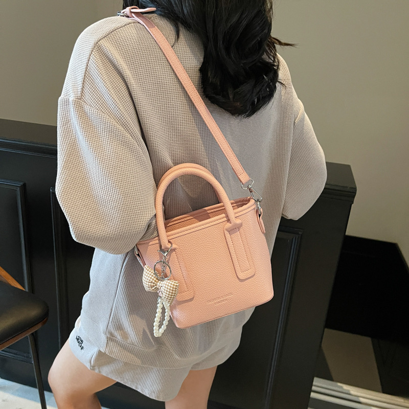 New designer bag, fashionable high beauty style small handbag, new multifunctional lychee pattern single shoulder bucket bag, niche light luxury cross