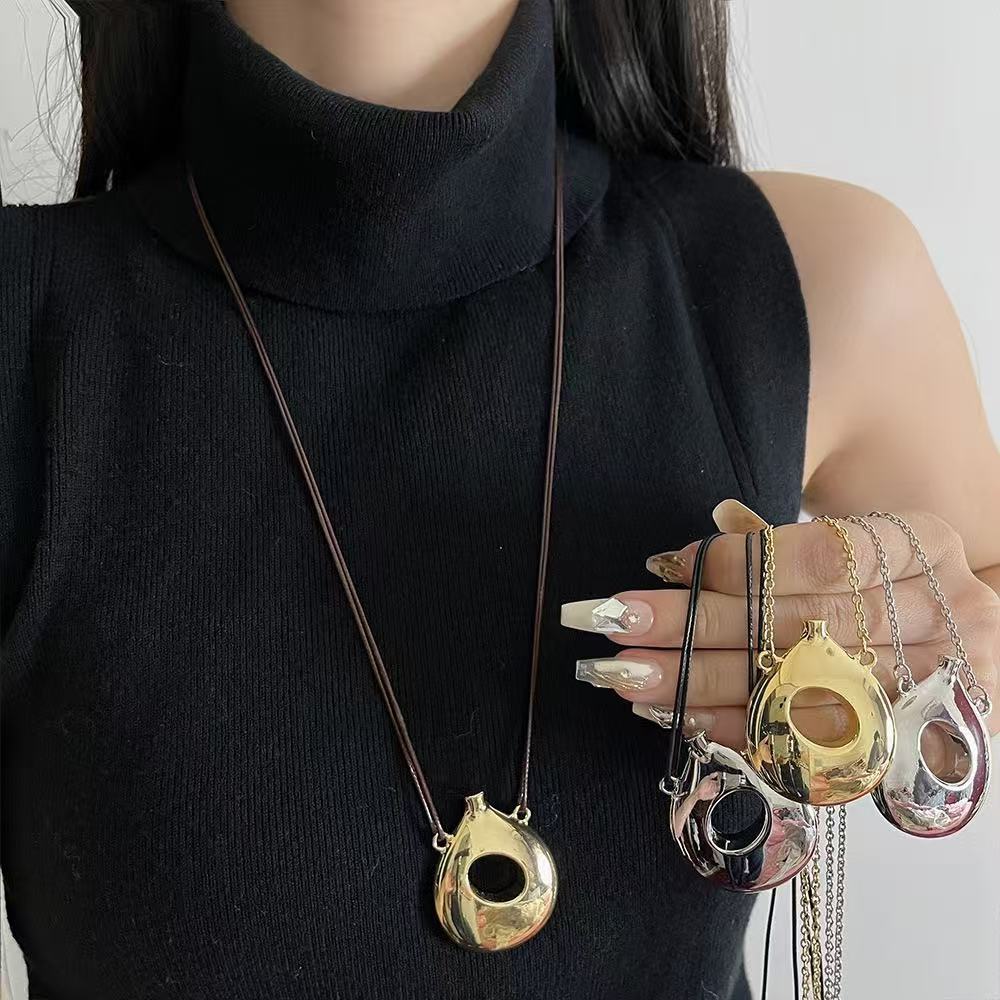 2025 Sculpture Hollow Solid Irregular perfume Bottle Pendant Small Design High Fashion Minimal Necklace Female