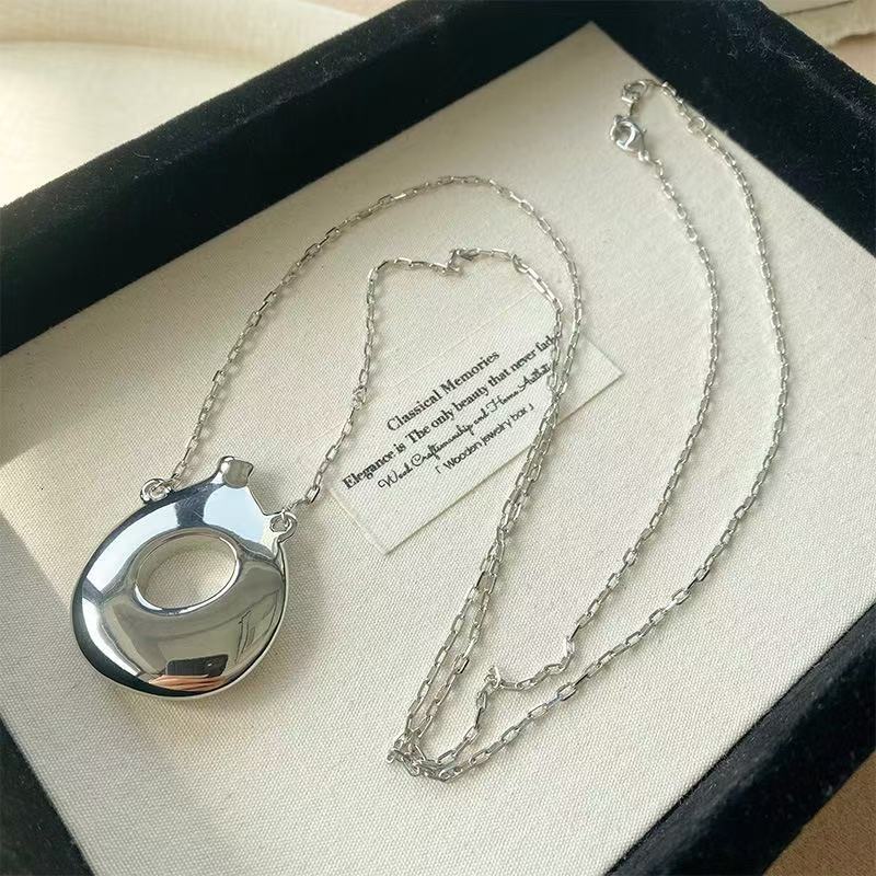 2025 Sculpture Hollow Solid Irregular perfume Bottle Pendant Small Design High Fashion Minimal Necklace Female