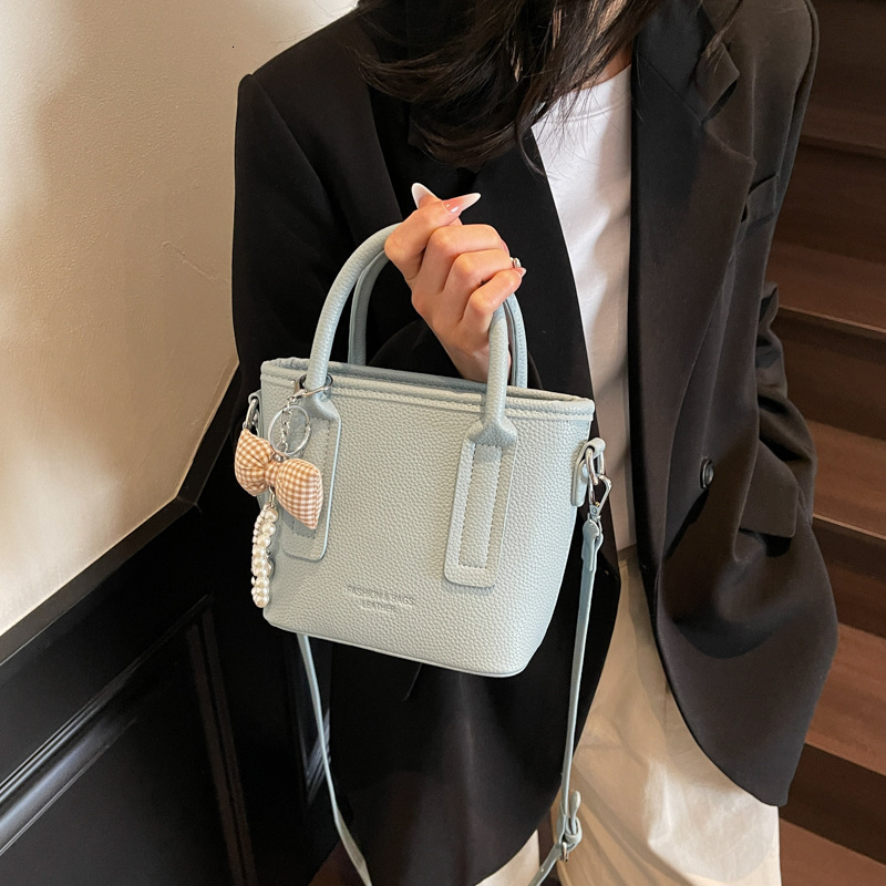 New designer bag, fashionable high beauty style small handbag, new multifunctional lychee pattern single shoulder bucket bag, niche light luxury cross
