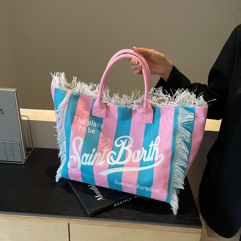 Design sense women's European American beach large capacity single shoulder commuting handmade tassel printed tote bag, new style, chic and elega
