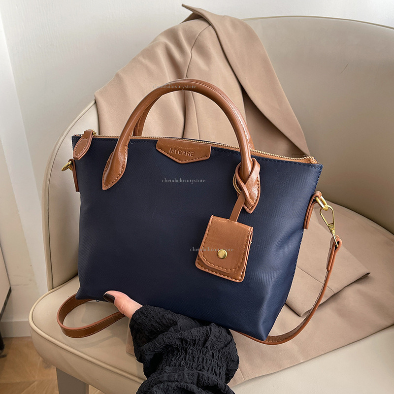 Designer Oxford Cloth Shoulder Bag Women's Simple Contrasting Letter Handbag 2025 New Fashionable Lightweight Commuting Shoulder Bag Crossbody Ba