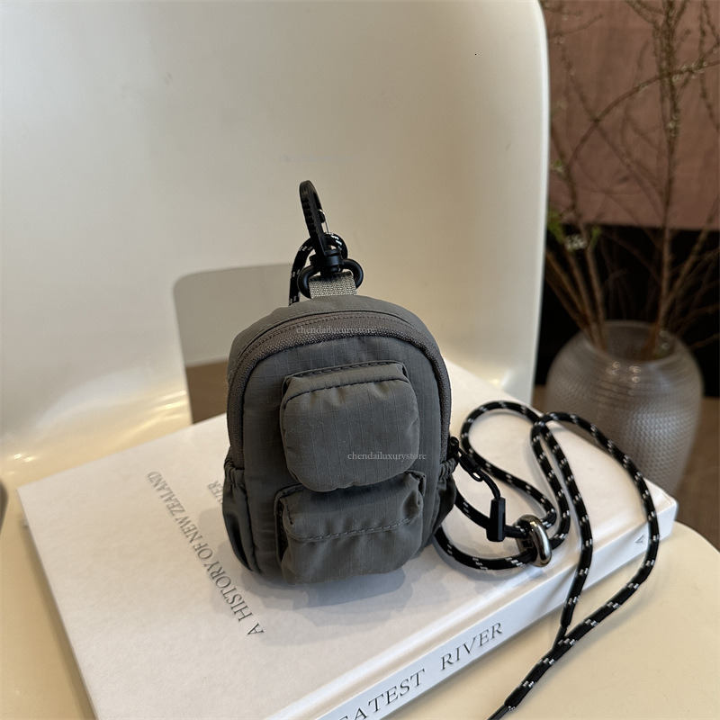 Designer pendant mini small square bag nylon waterproof women's multi pocket headphone bag minimalist solid color zipper crossbody bag coin pocke