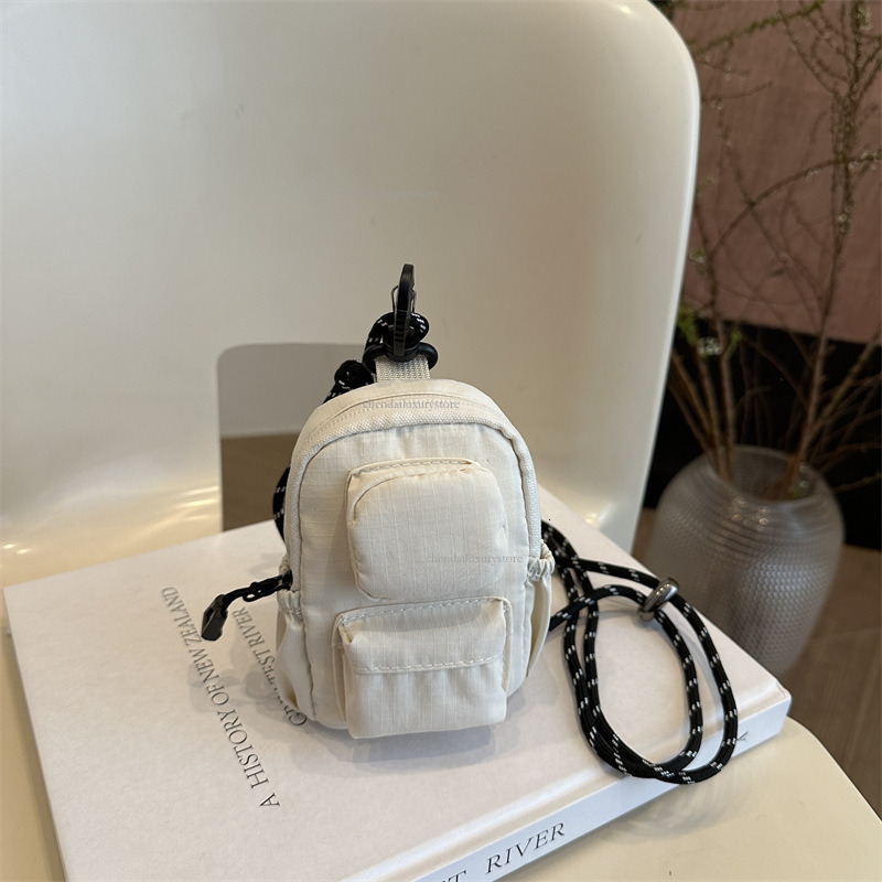 Designer pendant mini small square bag nylon waterproof women's multi pocket headphone bag minimalist solid color zipper crossbody bag coin pocke