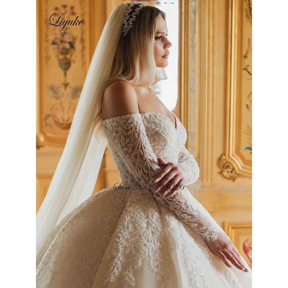 Liyuke Beauty Beading Pearls Ball Gown Princess Wedding dress Off Shoulder Full Sleeves Sparking Lace Court Train Bridal Gowns