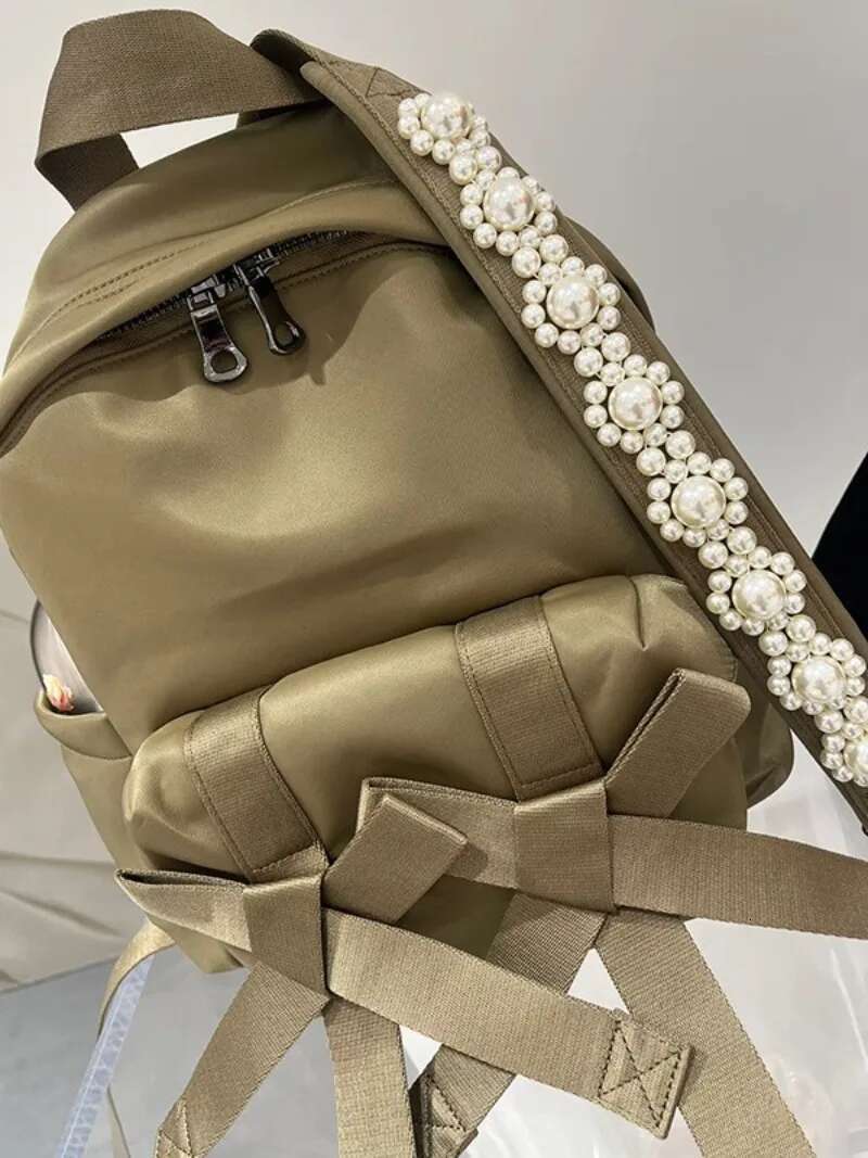 Bow Pearl Mochila Portable Nylon Mochilas Mujer 2025 New Casual Backpack Large Capacity Bolsa Korean Fashion Bags for Women
