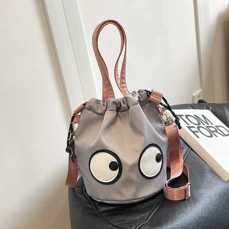 New Forest style waterproof nylon bag with quirky big eyes personalized handbag diagonal cross bag small tote bag bucket bag Z250512