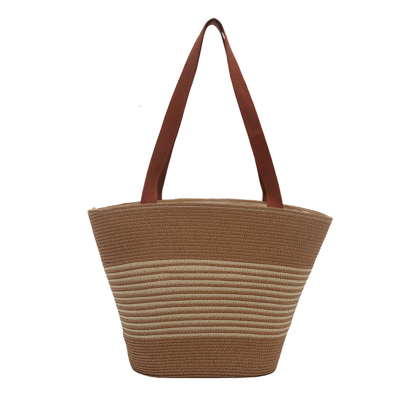 Fashion contrasting straw woven hand-held bucket women's 2025 summer new versatile shoulder casual armpit bag