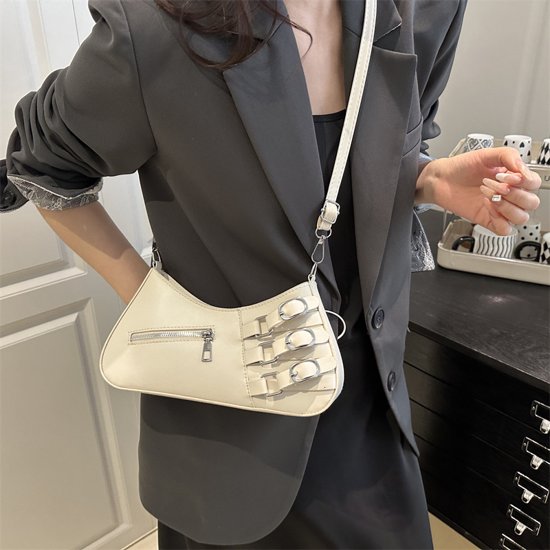 Small niche design hand-held baguette women's 2025 summer new item light luxury western-style shoulder commuting crossbody bag