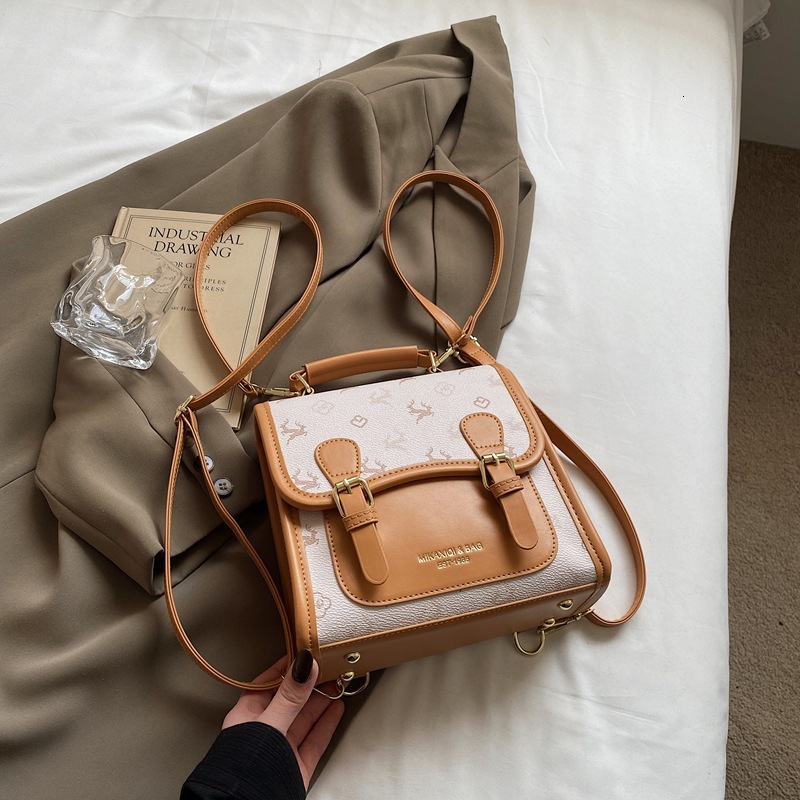 Korean version contrasting color hand-held small square women's 2025 summer new light luxury shoulder bag multifunctional backpack