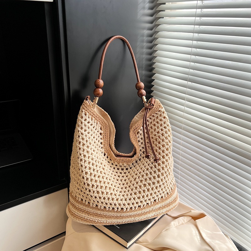 Beach vacation straw for women's 2025 summer new commuting shoulder crossbody bag, hollowed out woven tote bag