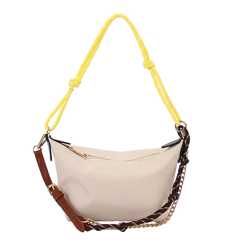 Extremely simple style hand-held gold ingot women's 2025 summer new fashion shoulder internet famous trend crossbody bag