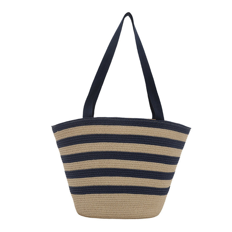 Color blocking hand-held bucket women's 2025 summer new item light luxury grass woven shoulder fashionable armpit bag