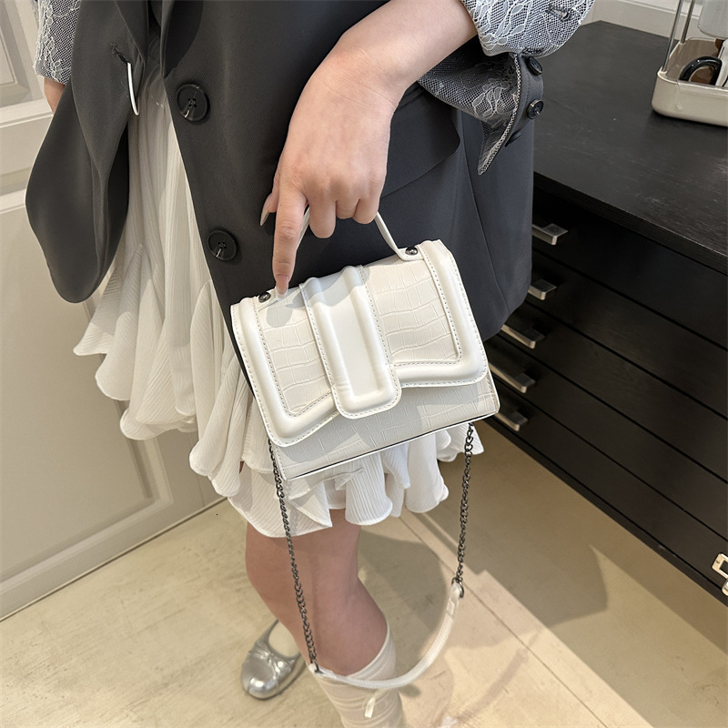 Simple hand-held small square women's 2025 summer new style light luxury western-style shoulder commuting crossbody bag