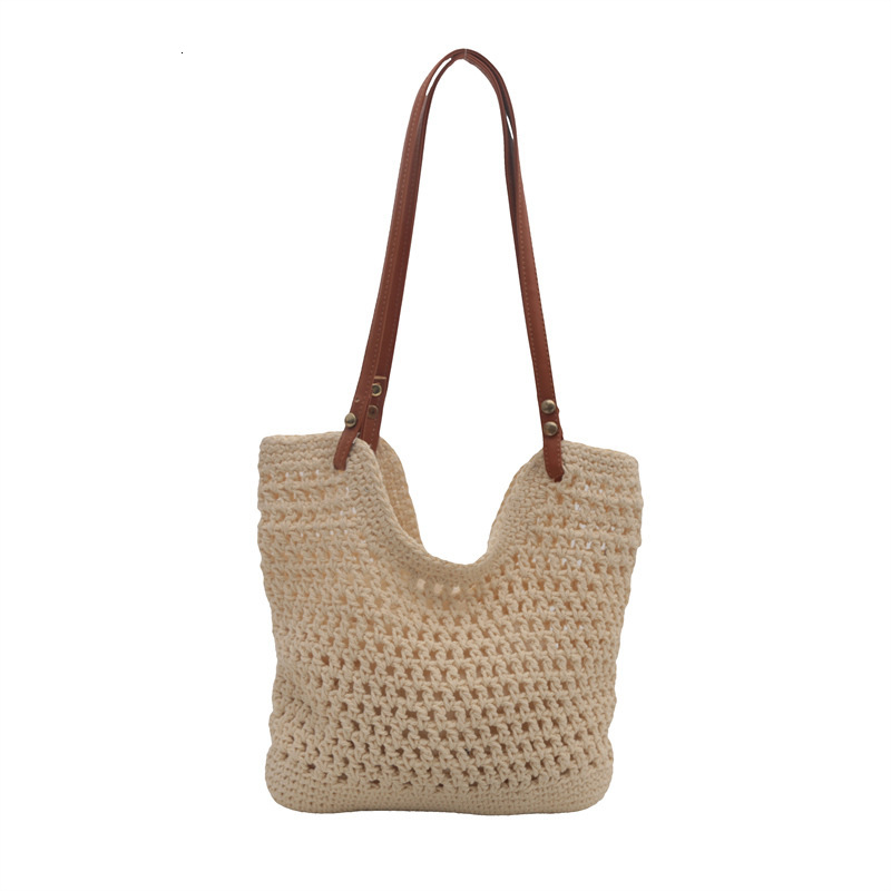 2025 new bag large capacity handmade designer women's grass woven beach vacation shoulder carrying commuting handbag