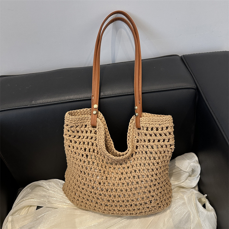 2025 new bag large capacity handmade designer women's grass woven beach vacation shoulder carrying commuting handbag