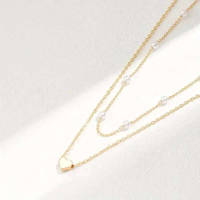 Hot selling imitation pearl heart-shaped pendant necklace, versatile collarbone chain, women's double-layer layered necklace