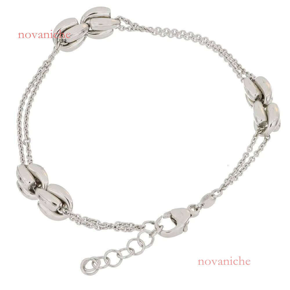 Made in Italy, this pure sier bracelet features a stylish adjustable design with double chain and knot decorations