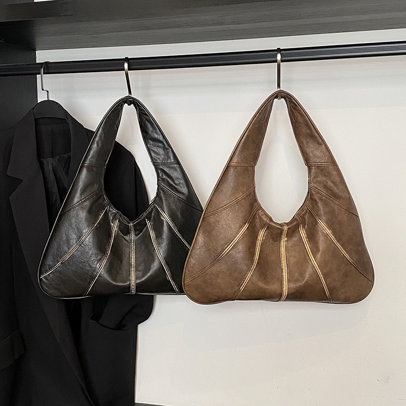 Niche design handbag women's 2025 summer new fashion splicing shoulder commuting armpit bag