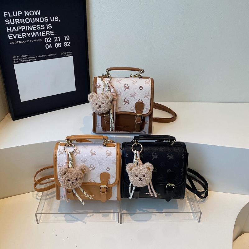 Korean version contrasting color hand-held small square women's 2025 summer new light luxury shoulder bag multifunctional backpack