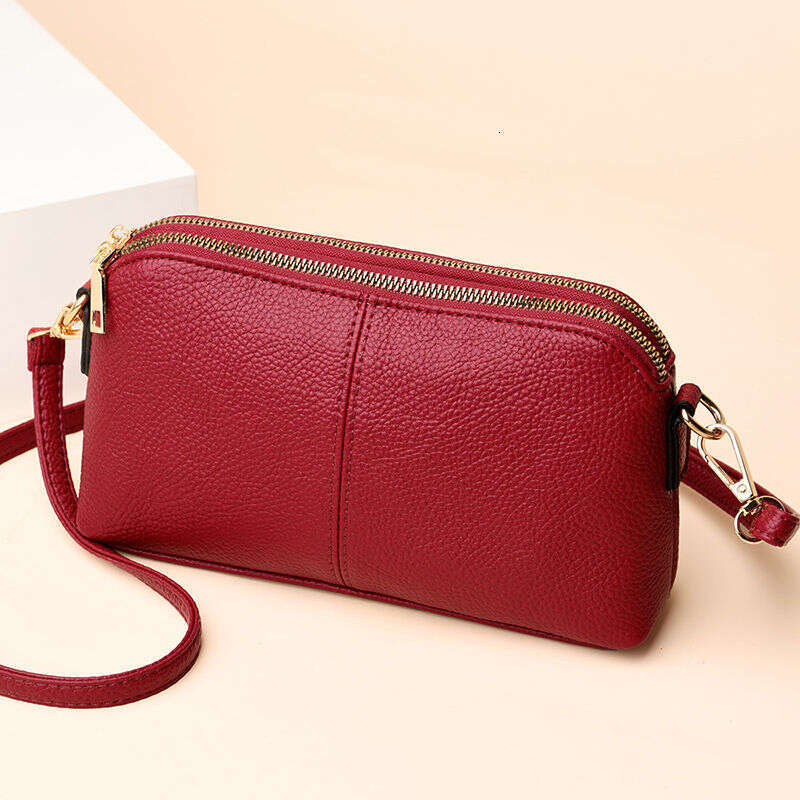 Handheld for women 2025 new fashion Korean version soft leather single shoulder versatile multi-layer small bag hand-held shell bag