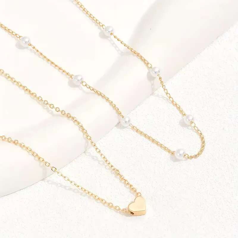 Hot selling imitation pearl heart-shaped pendant necklace, versatile collarbone chain, women's double-layer layered necklace