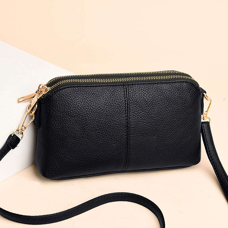 Handheld for women 2025 new fashion Korean version soft leather single shoulder versatile multi-layer small bag hand-held shell bag
