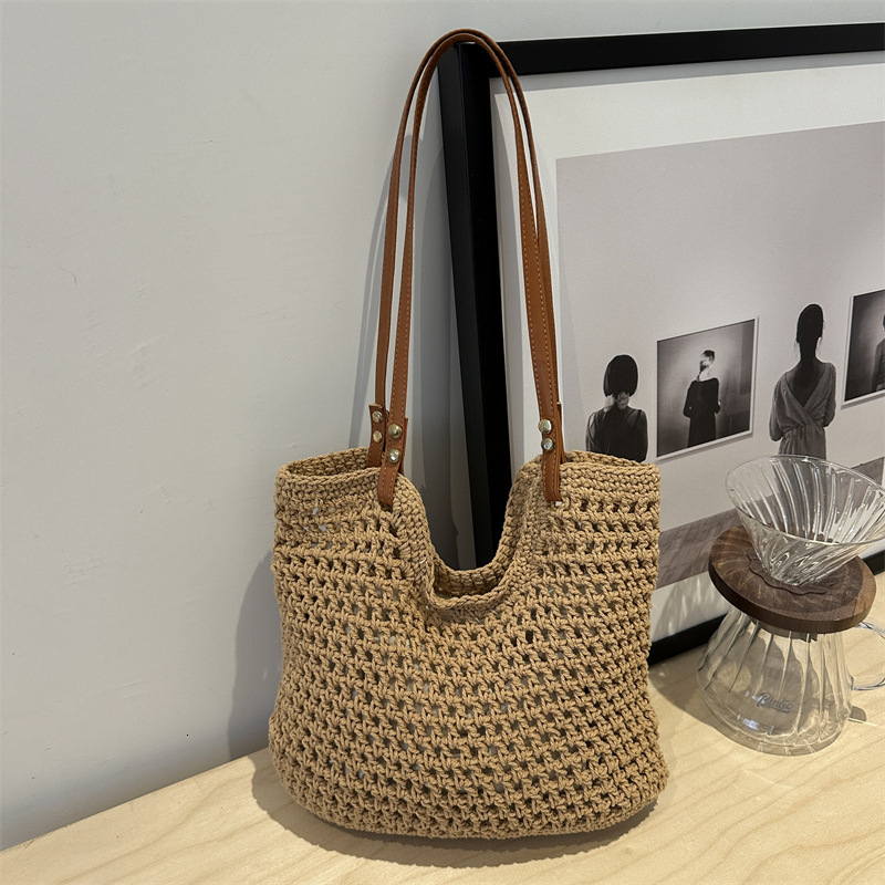 2025 new bag large capacity handmade designer women's grass woven beach vacation shoulder carrying commuting handbag