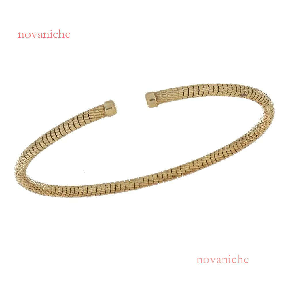Made in Italy, this elegant handmade open bracelet features a unique and flexible gold design