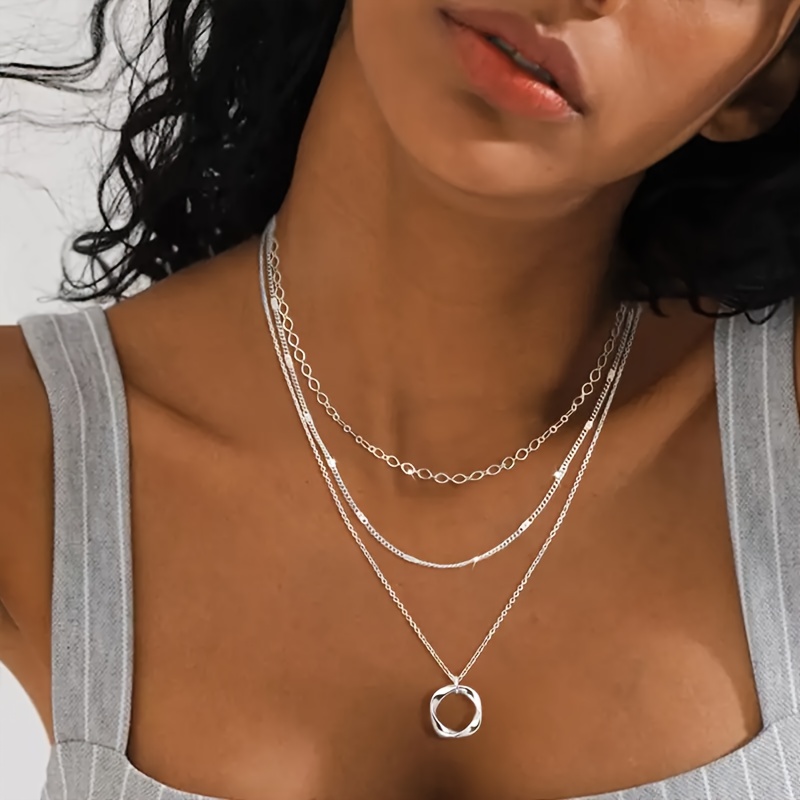 Stylish Multilayered Choker Style Collar Accented by Smooth Oval Pieces Available In Shimmering Finish